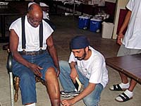 Baldeep Singh examining an injury.