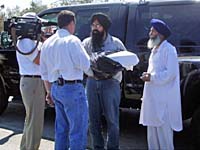 UNITED SIKHS volunteers speaking to the local media.