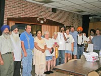 UNITED SIKHS volunteers with the director of Ward 7 and members of the community of Chauvin, LA.