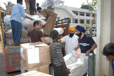 Photograph. The UNITED SIKHS team loads the shipment for Campbell Bay