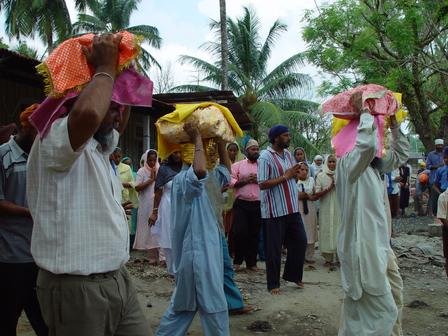 Sikhs taking the swaroops to 'Agan Bhet' or cremation