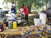 Satguru and Deva Singh preparing food at Allen Chapel.