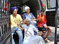 UNITED SIKHS volunteers helping move books.